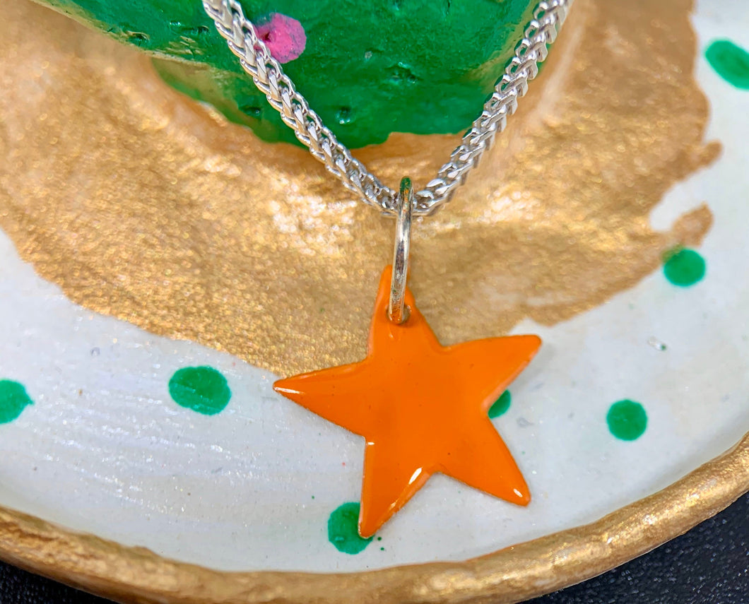 Sterling Silver Star Charm with Orange Enamel.